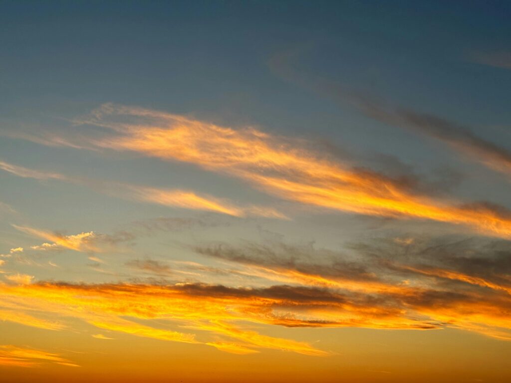 Stunning Sunsets in Guzzano, Tuscany: A Moment to Slow Down Vibrant sunset sky with orange and blue hues in a tranquil atmosphere.