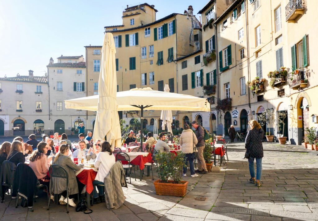 People enjoying an outdoor meal in Lucca