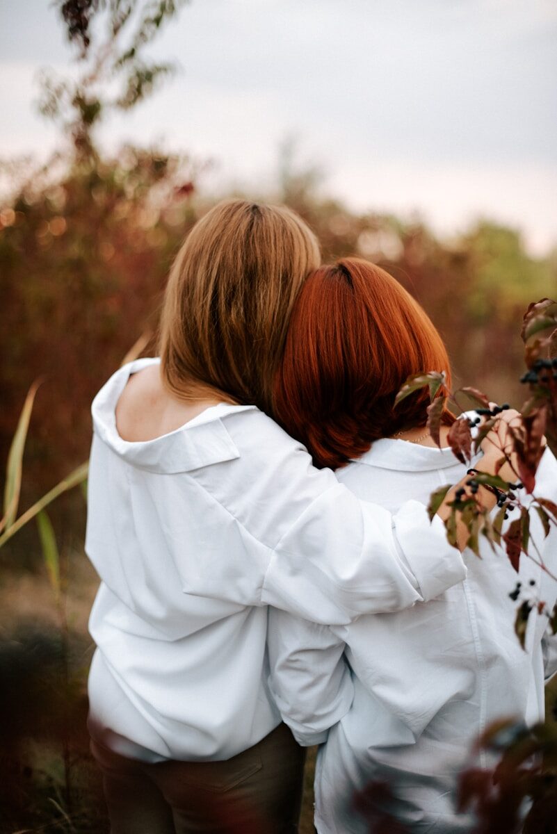 a couple of people that are hugging each other