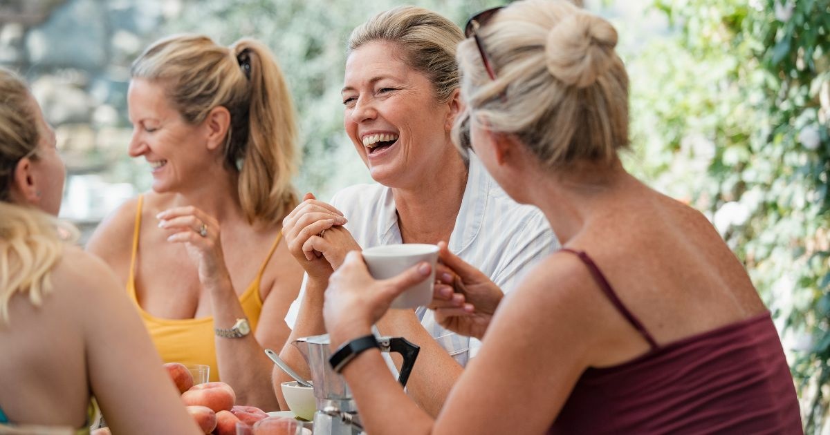 Gallery Friends laughing over breakfast